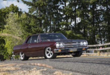 001 1965 Chevrolet Chevelle burgundy restomod parked roadside stance profile