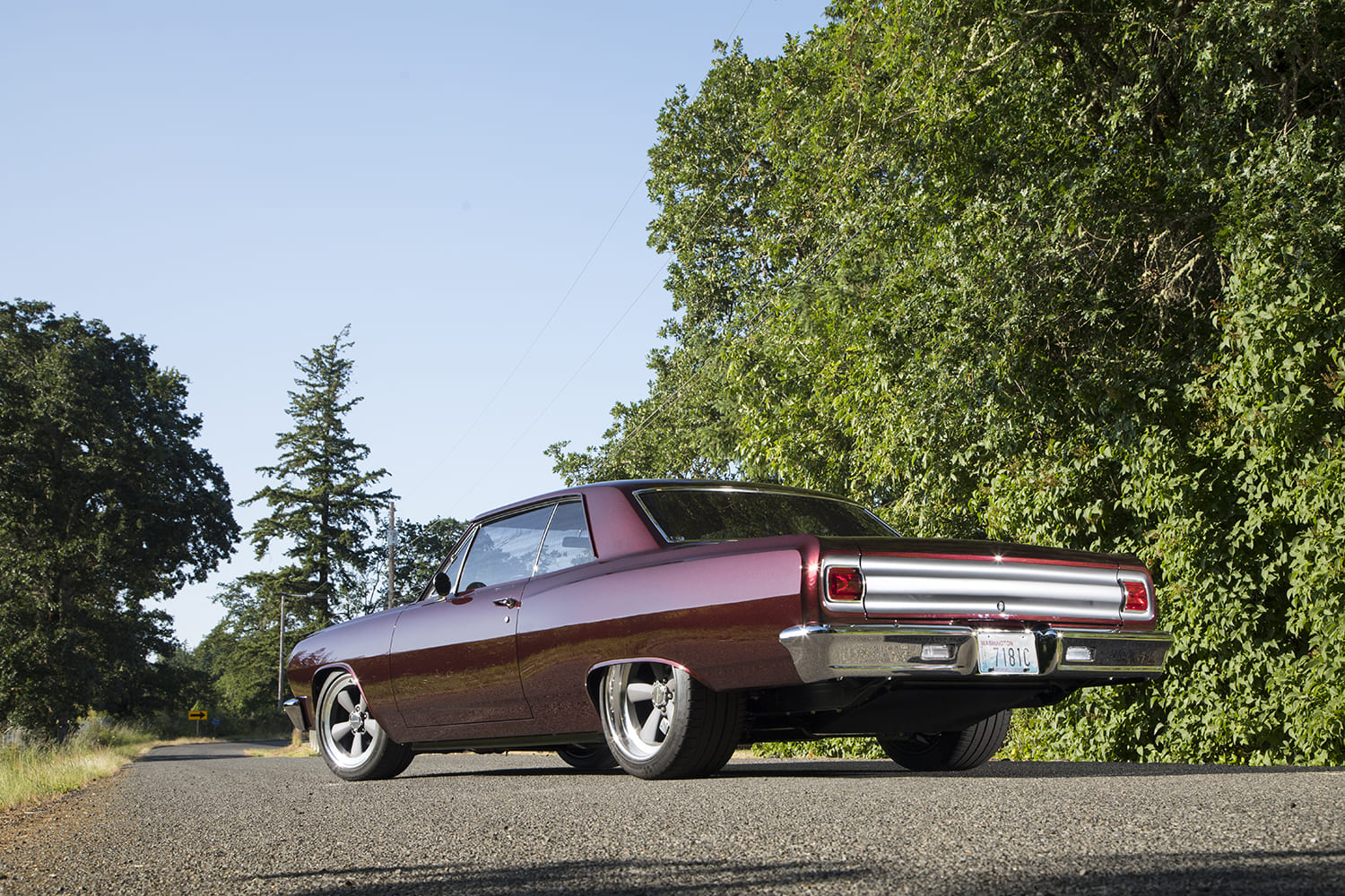 003 1965 Chevrolet Chevelle rear three quarter view burgundy restomod styling