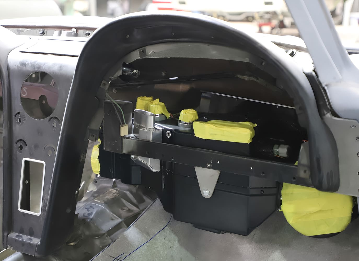 011 1965 Corvette dash framework install with HVAC mock up and taped wiring pass throughs