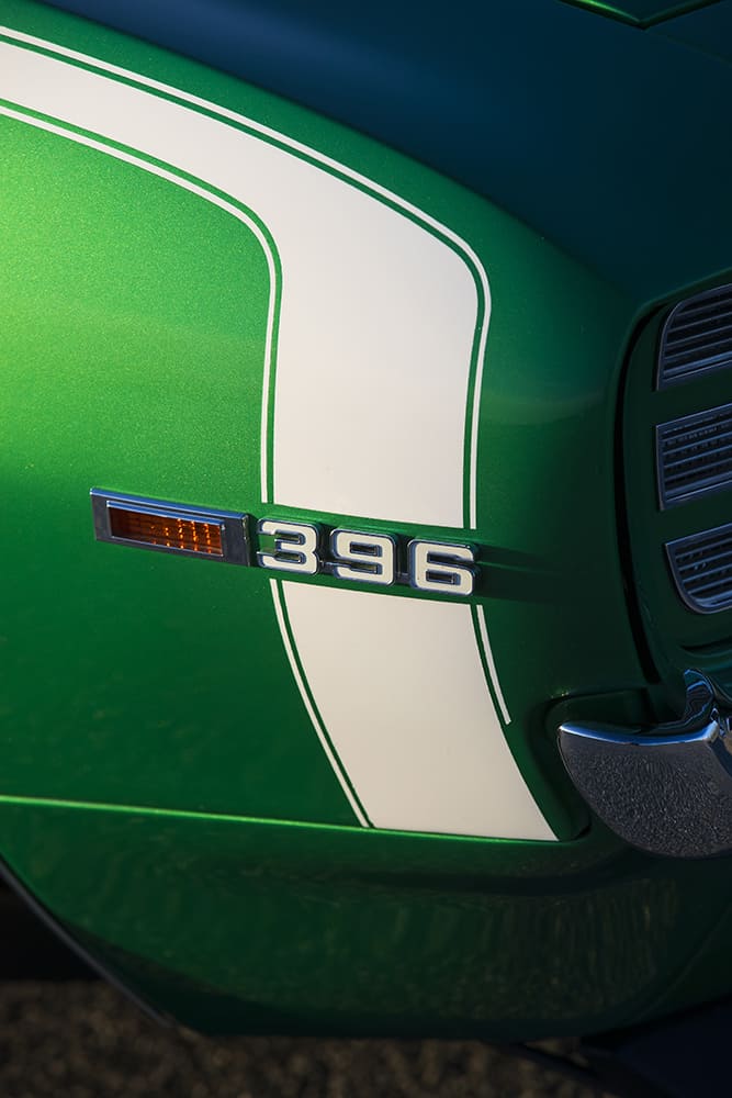 012 1969 Camaro SS Rallye Green fender close up 396 badge white hockey stripe detail