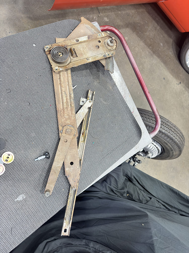 015 1971 camaro original window regulator removed placed on bench