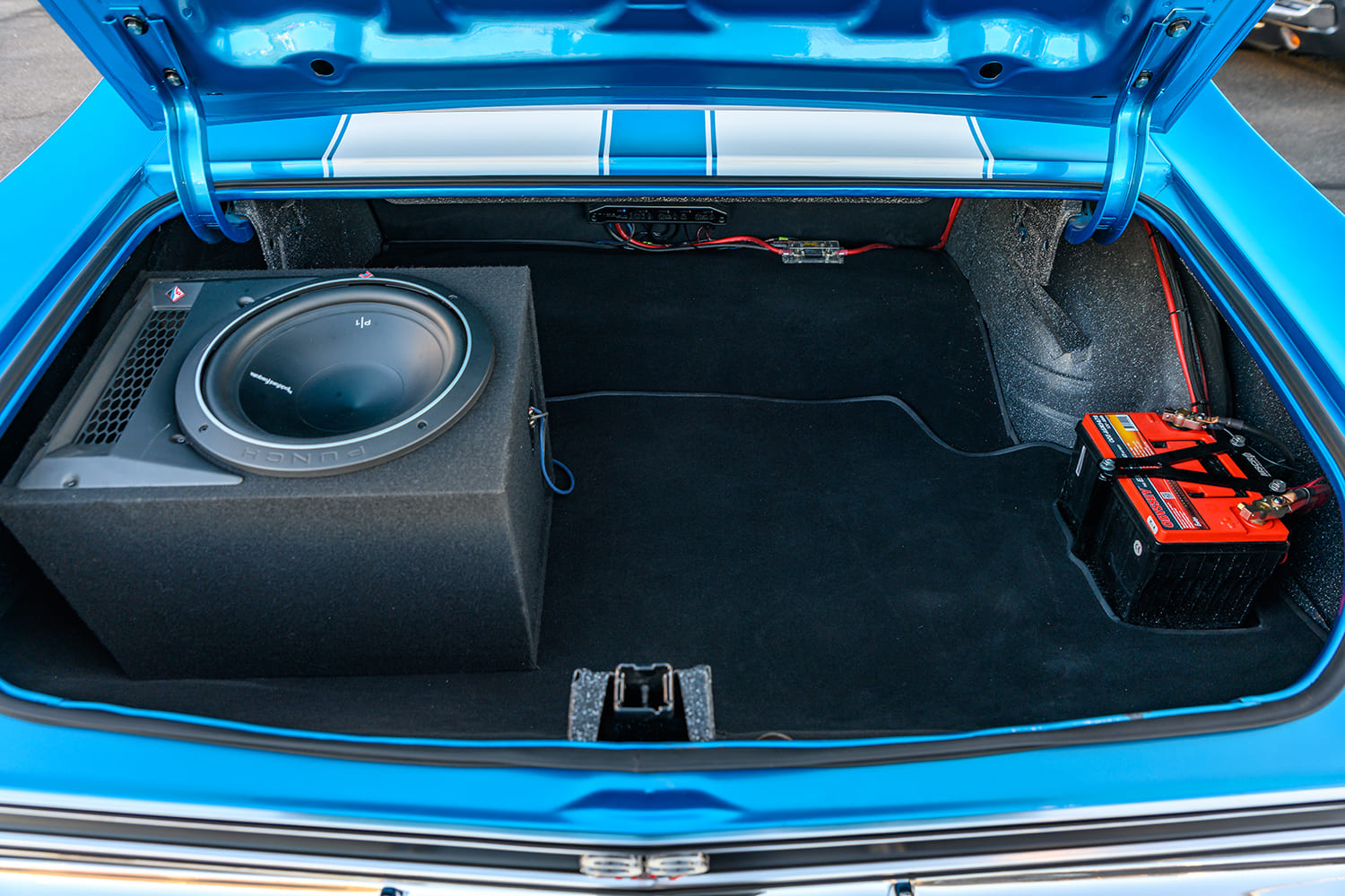 019 1969 Chevelle SS trunk Rockford Fosgate subwoofer Optima red top battery blue rally stripes
