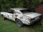 019 1969 Chevrolet Camaro rear quarter view rusted shell project car barn find with missing rear window