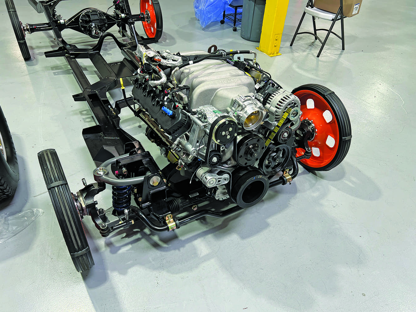 05 1956 Mustang Godzilla engine on full chassis with front suspension and orange rollers
