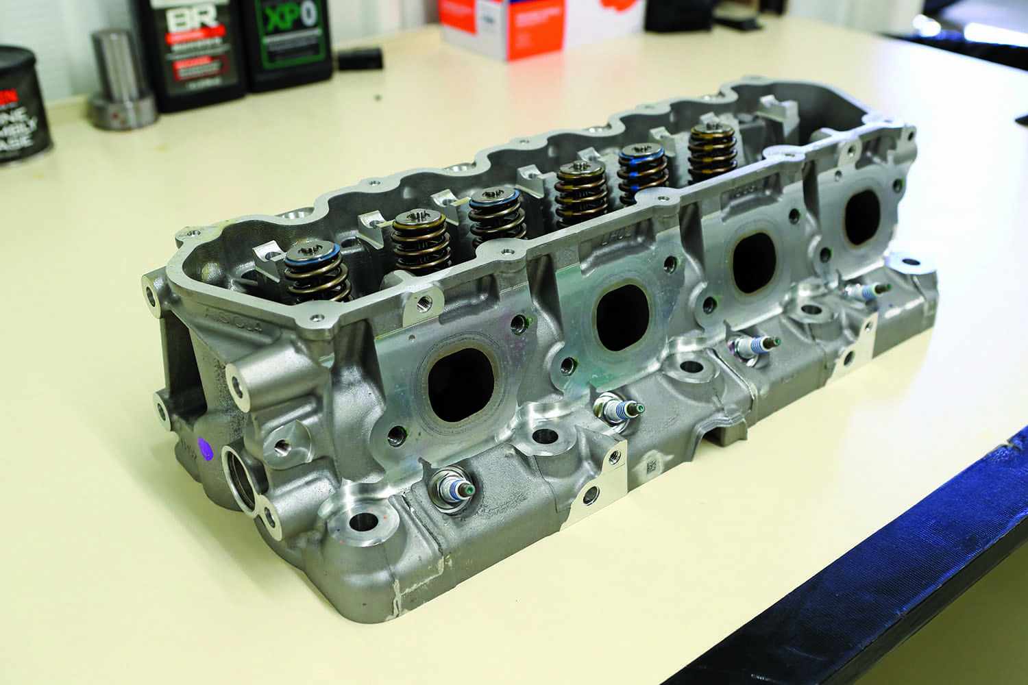 14 Ford Godzilla cylinder head intake and exhaust ports assembled valve springs closeup