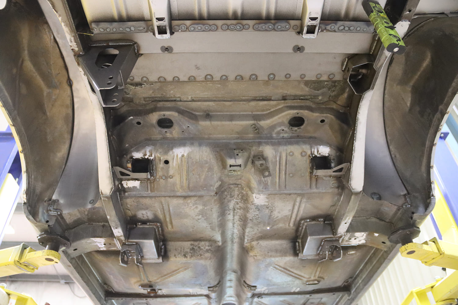 005 1963 Chevy Nova Rear chassis view prepped for QUADRALink installation with wheel tubs and rails exposed