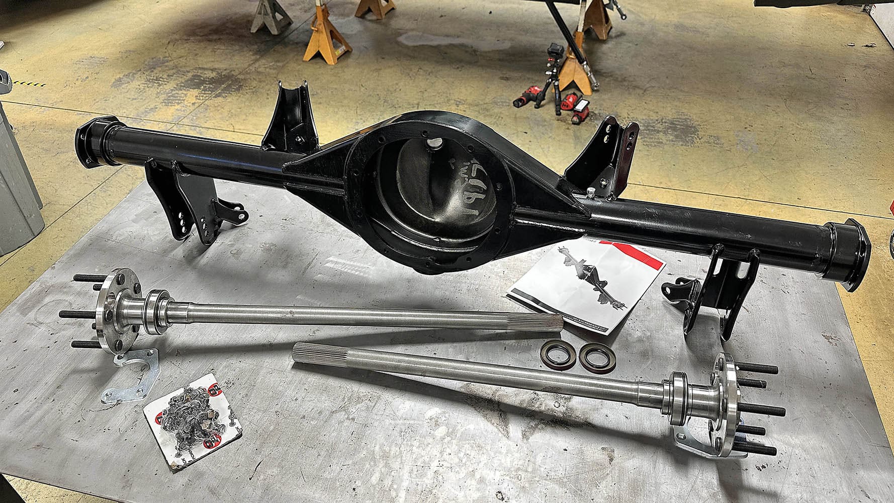 009 1978 camaro moser rear axle housing and axles on bench