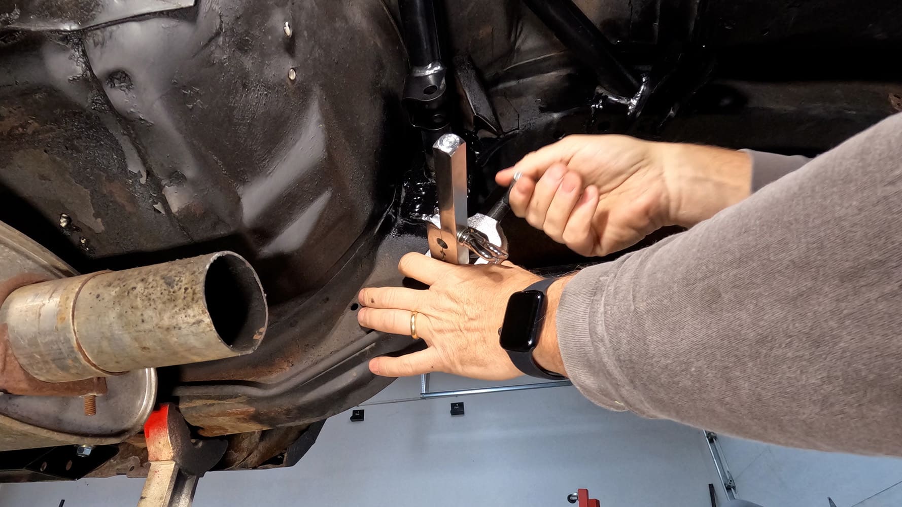 015 1978 camaro g bar suspension bracket being clamped in place