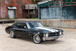 02 1971 Chevelle SS black white racing stripes chrome wheels front three quarter industrial backdrop