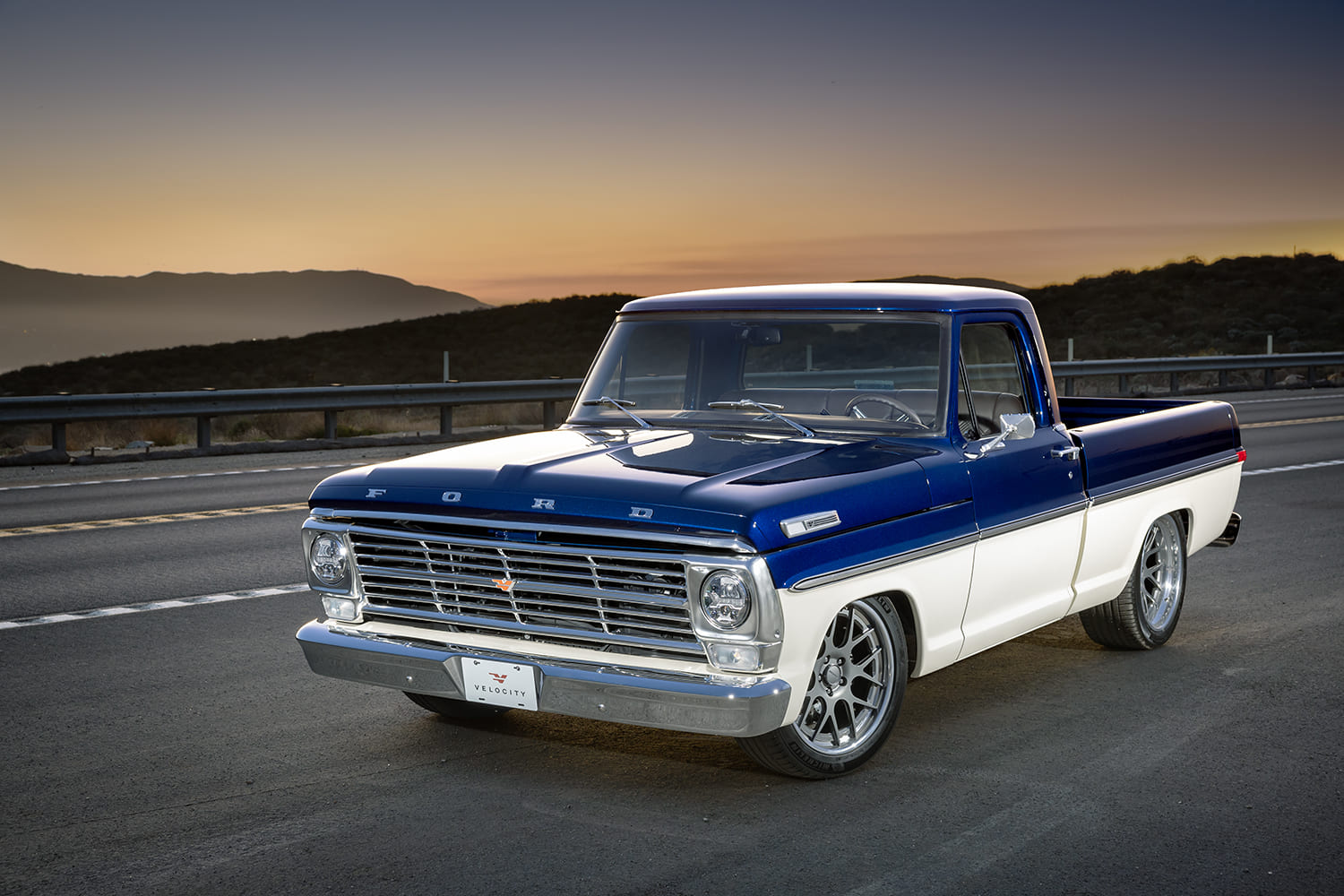 02 Restored 1967 Ford F100 sunrise shot paved road custom two tone