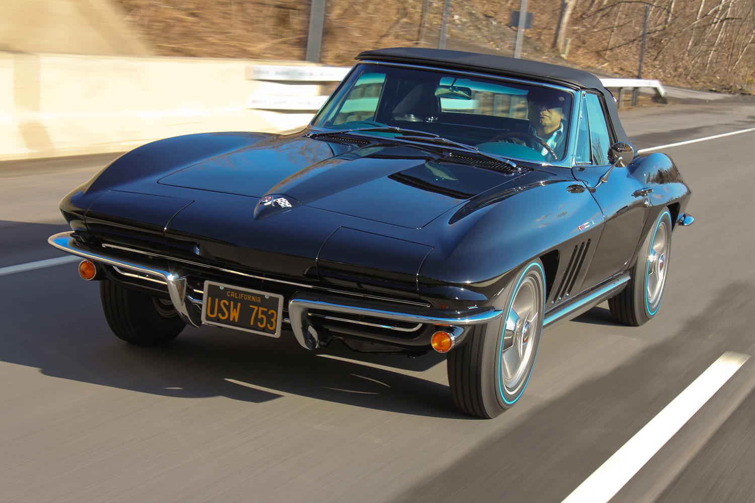 07 1965 corvette sting ray black coupe driving front angle