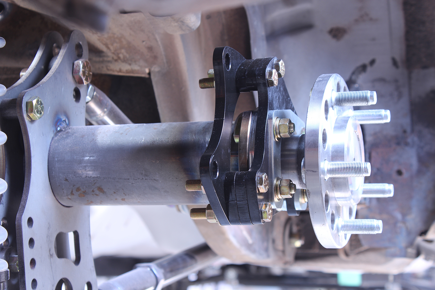 12 1965 mustang cpp rear axle bracket install 9 inch housing caliper mount black bracket