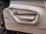 1958 Chevrolet Corvette custom door panel leather upholstery chrome trim modern speaker integration
