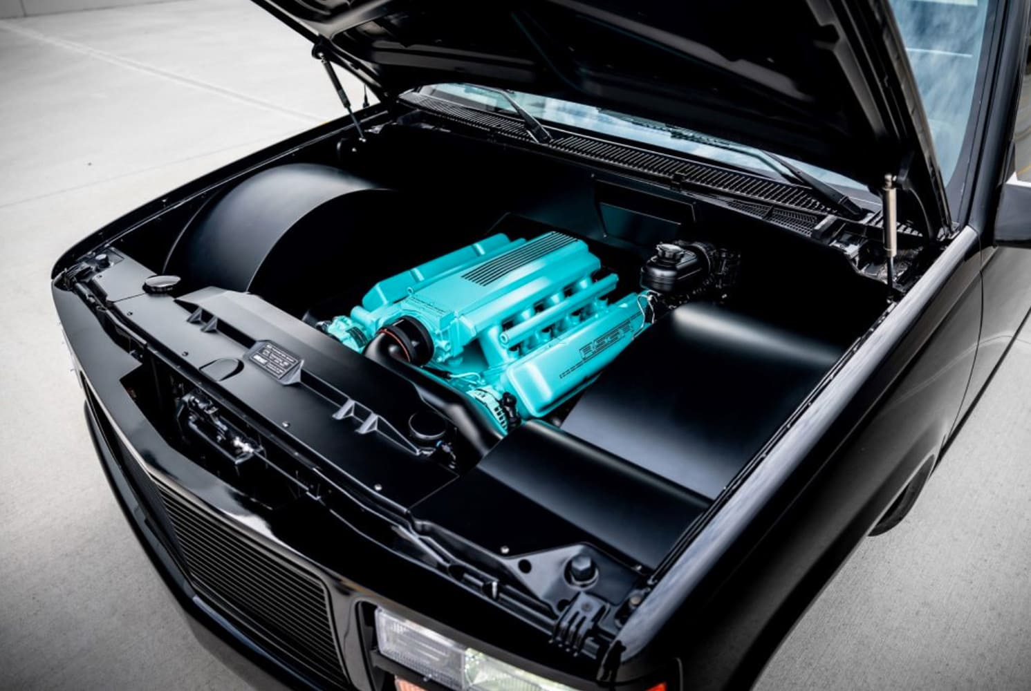 24 1990 Chevy C1500 OBS smoothed engine bay aqua painted intake manifold