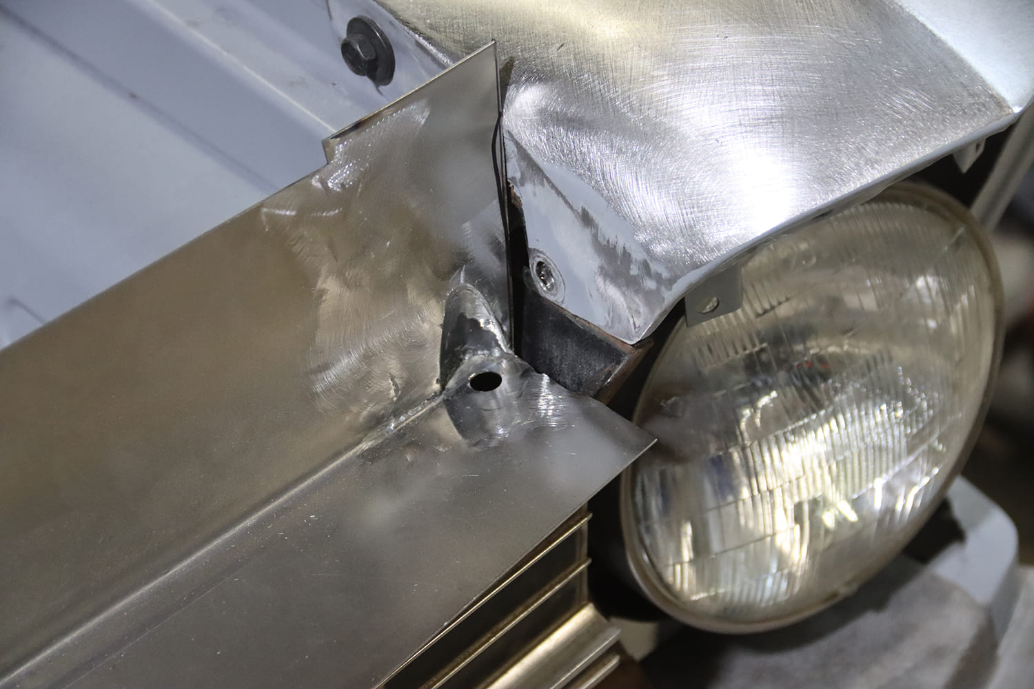 25 1967 chevy nova core support corner bracket installed headlight fitment