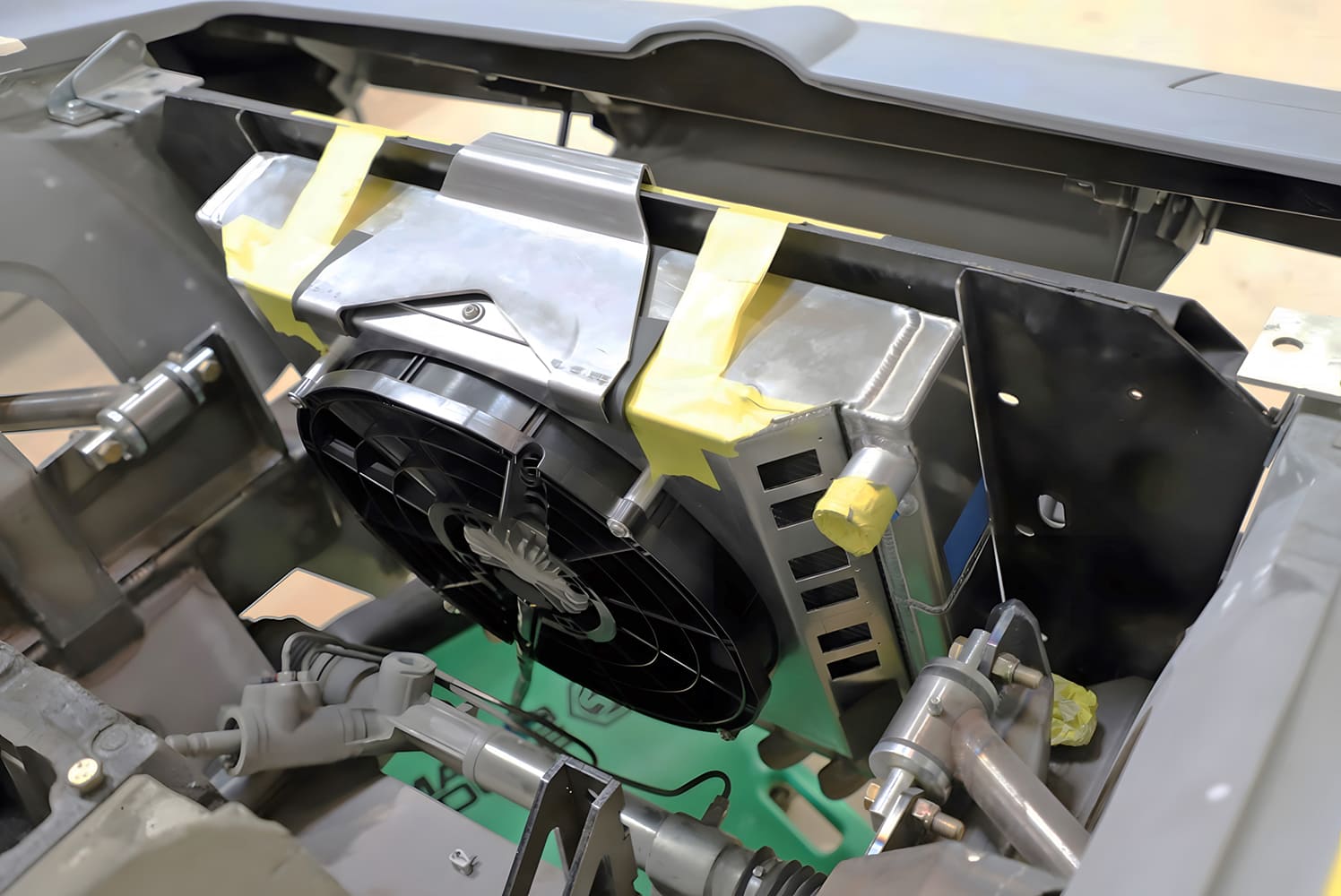 test fit spal fan and custom aluminum shroud mocked up with taped brackets on a corvette custom