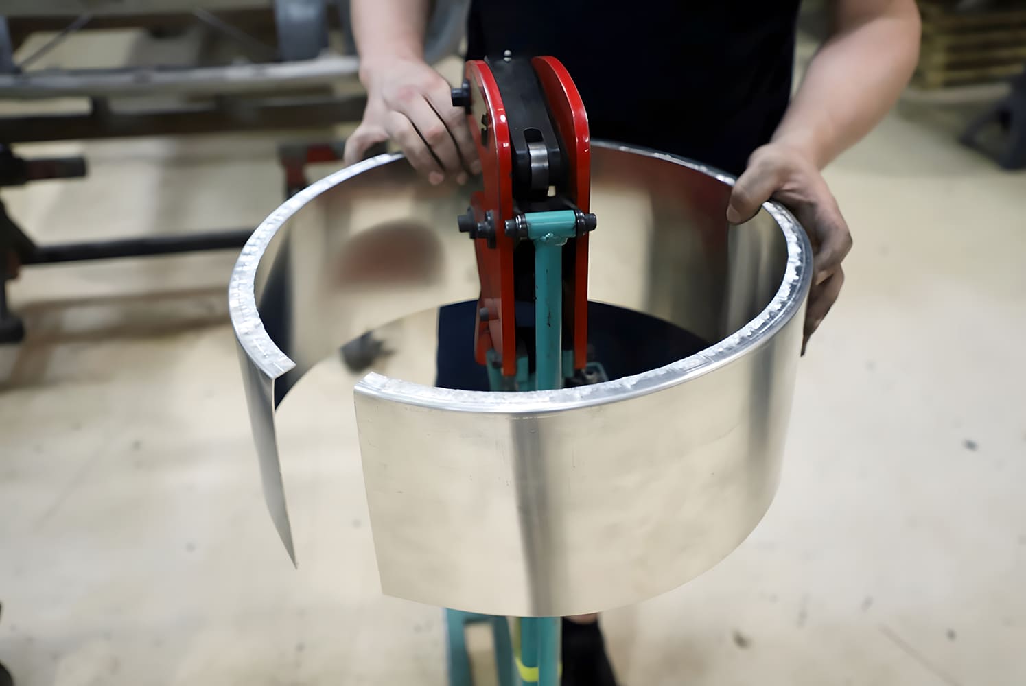 aluminum shroud ring formed using a bead roller