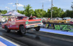 green headlights on red chevy ii drag car
