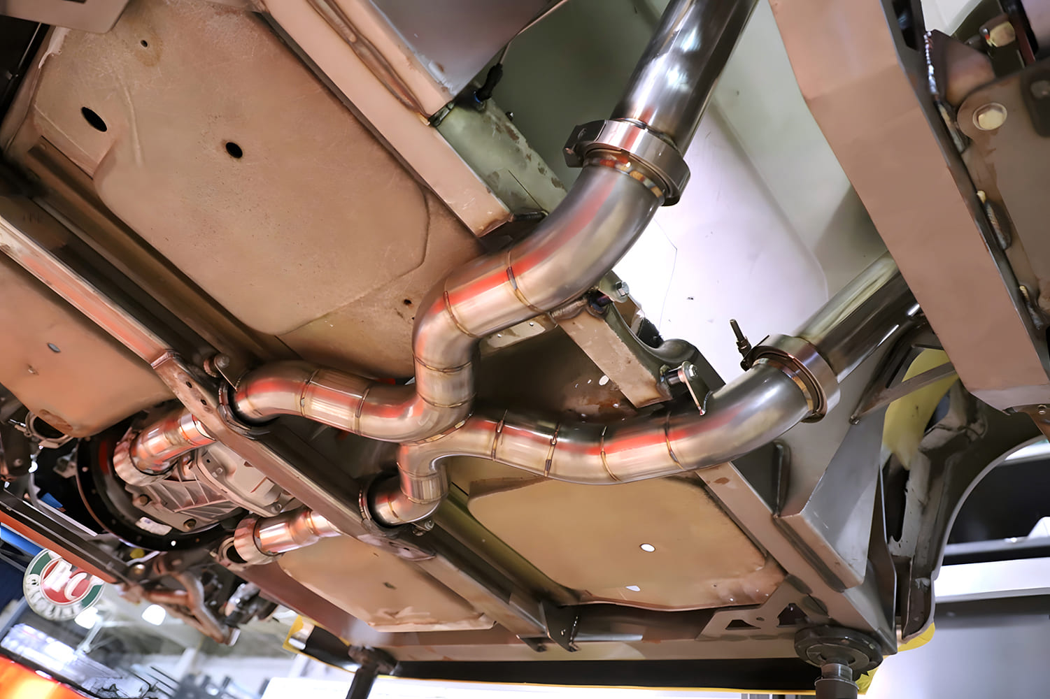 Mandrel bent stainless exhaust system tunneled and notched crossmebers
