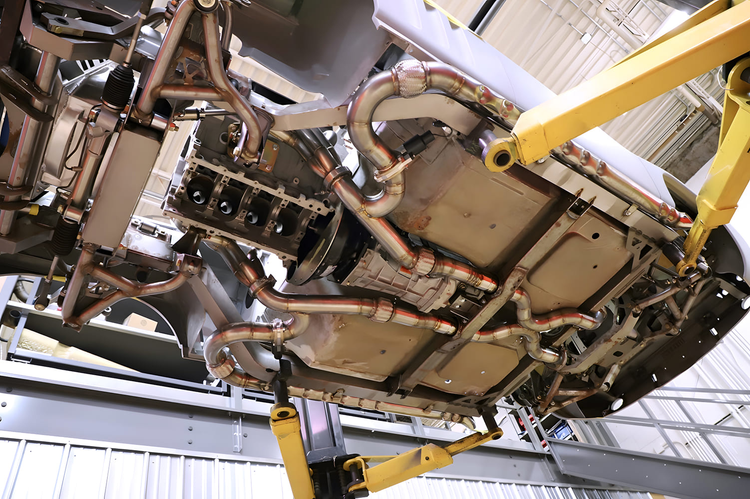 021 1965 Chevy Corvette Full underbody view reveals symmetrical exhaust layout and reinforced chassis structure