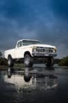 05 1977 Ford F 150 wet reflection all terrain tires bright sky