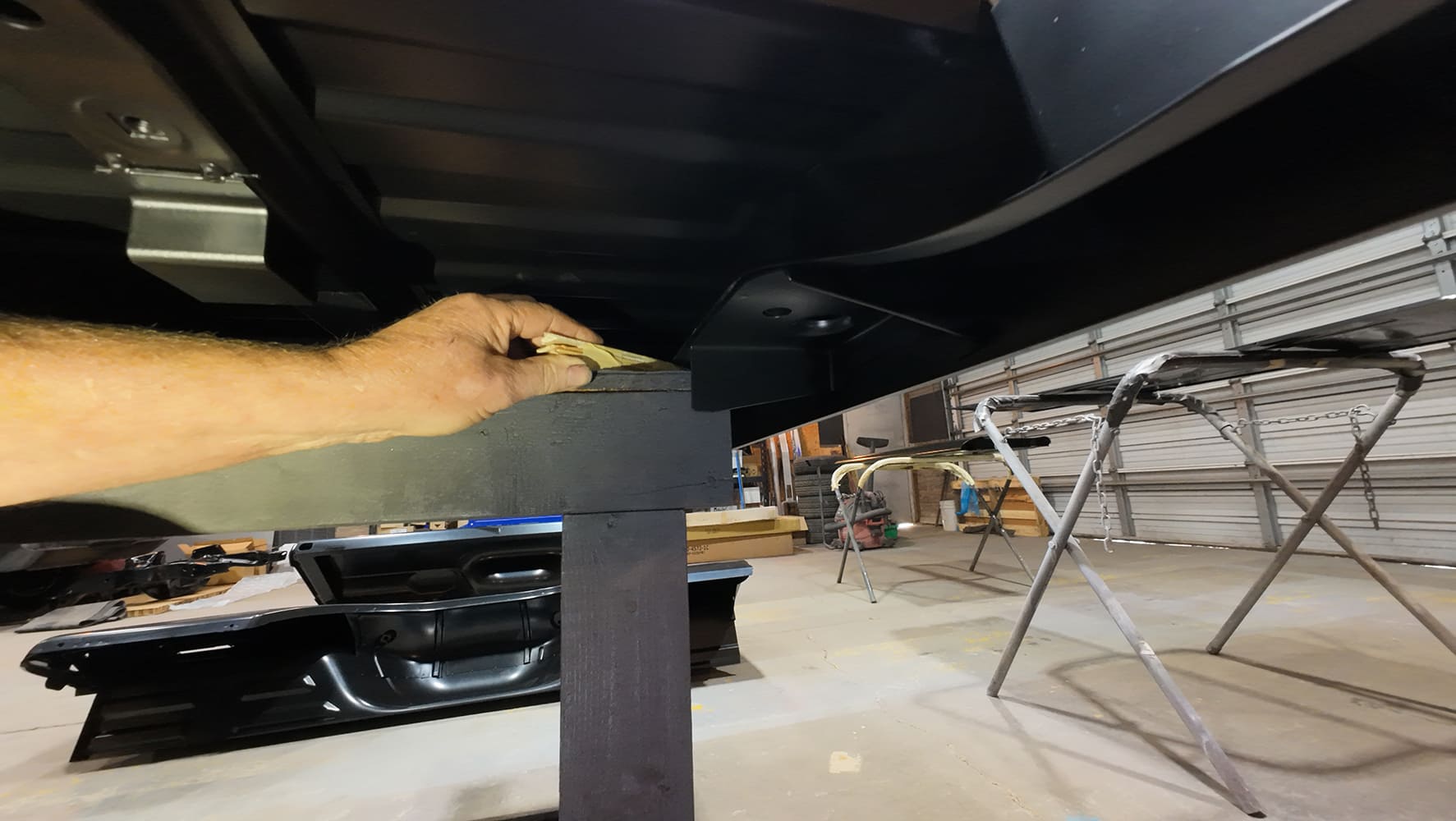 dentside ford short bed leveled with wood shims during assembly