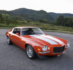 1970 Chevrolet Camaro Z28 custom orange front three quarter parked silver stripes pro touring stance