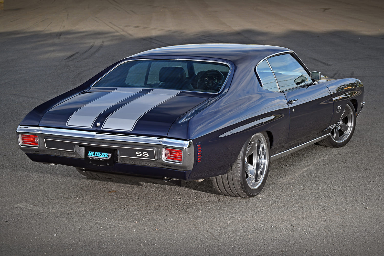 1970 Chevrolet Chevelle SS 396 blue pro touring rear three quarter view custom stance stripes
