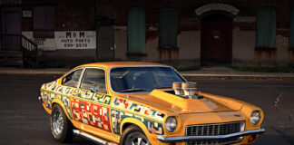 1971 Chevrolet Vega custom drag car front three quarter view yellow paint chrome wheels hood scoop