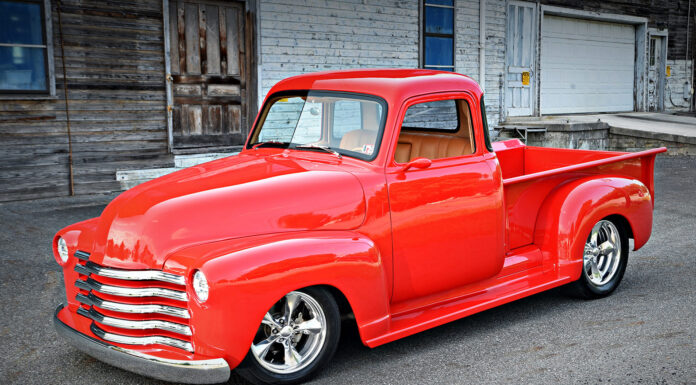 Dennis Schaffner’s Street Rod–Inspired 1947 Chevy 3100 47 Chevrolet 3100 custom red pickup truck front three quarter view chrome grille lowered street rod