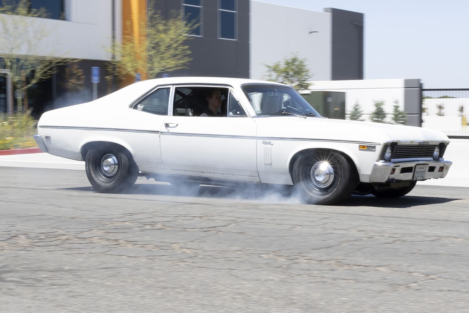 chevrolet nova brake test rolling side view white classic muscle car tire smoke street action