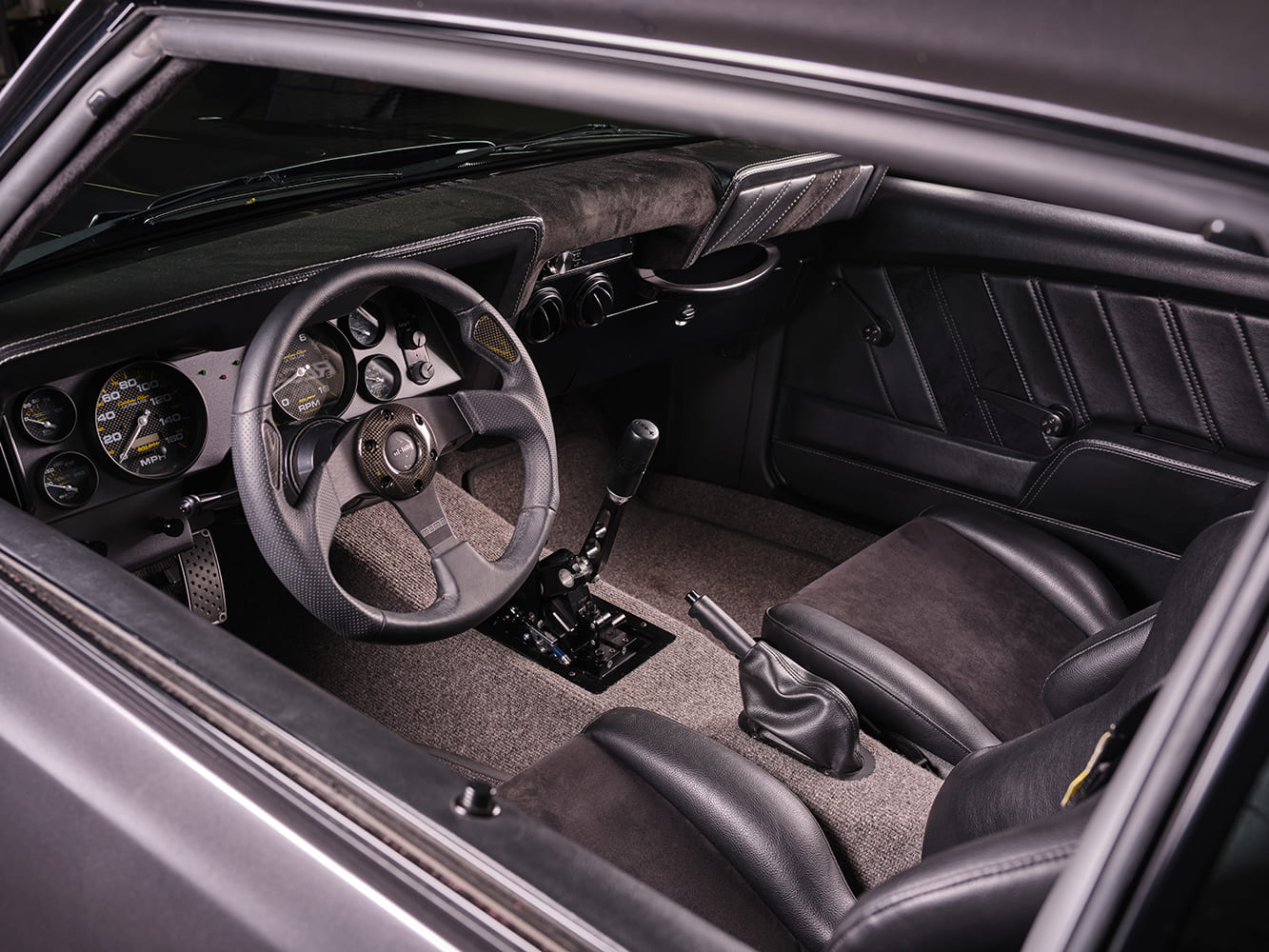 1969 Chevrolet Camaro custom interior dashboard steering wheel manual shifter pro touring cockpit detail