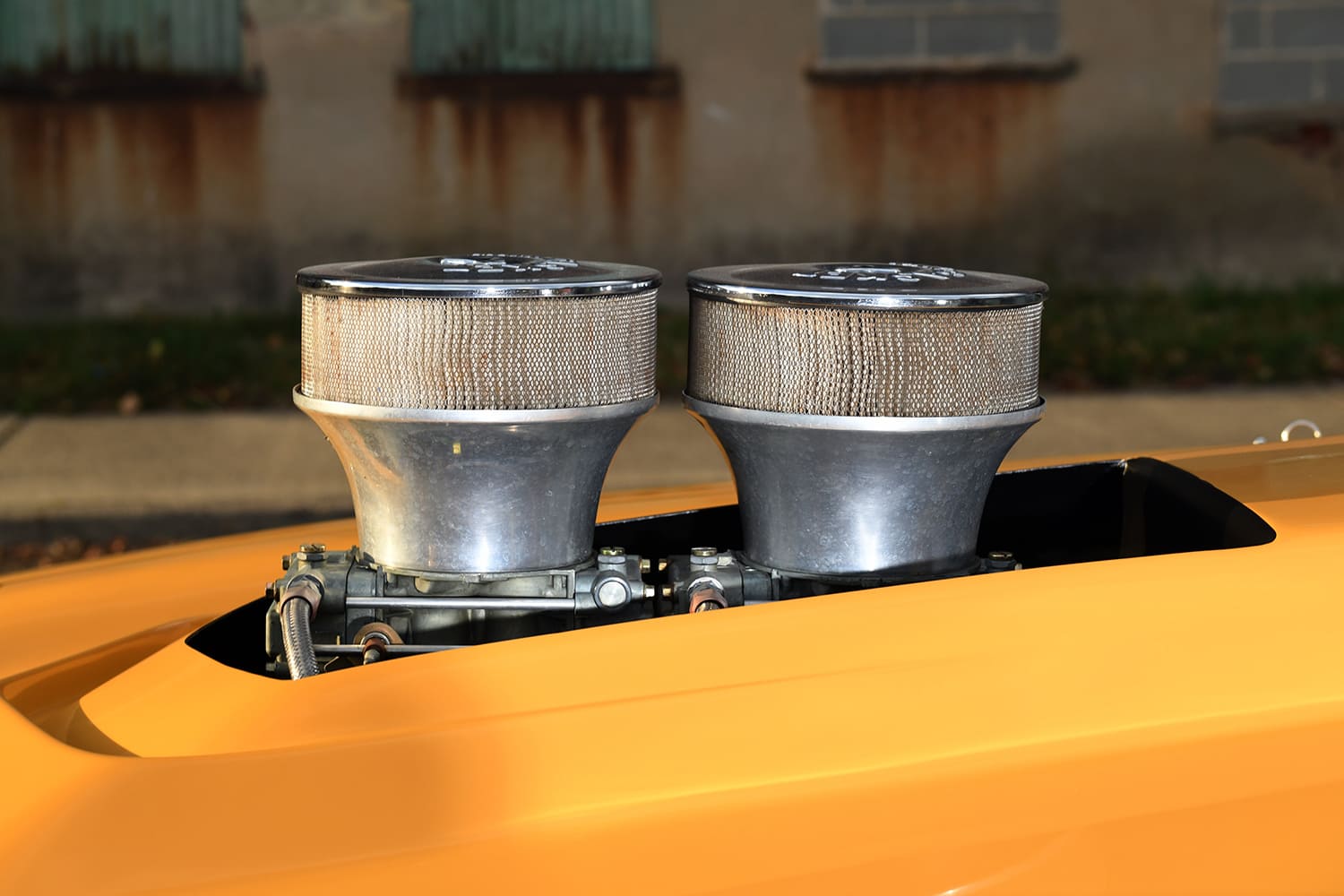 dual carburetor hood scoop intake stacks close up