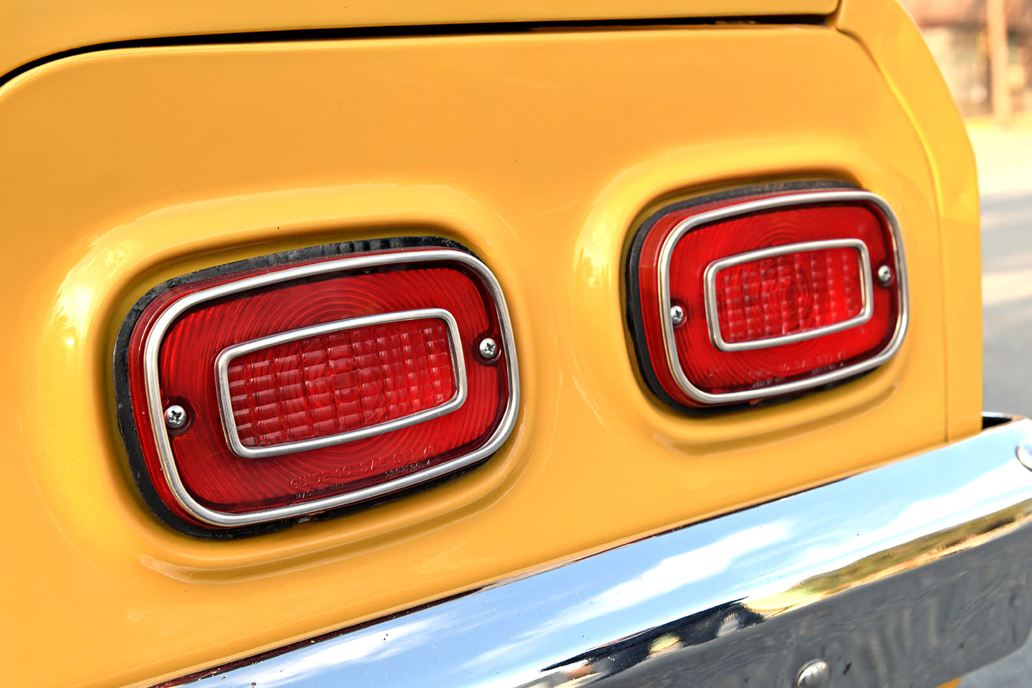 1971 Chevrolet Vega taillights chrome bumper detail yellow paint