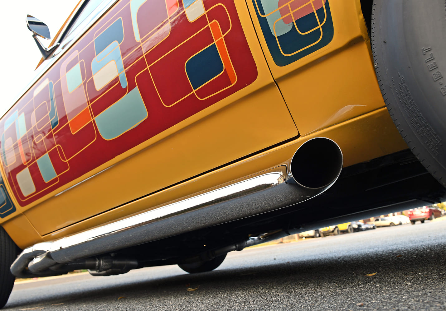 Vega side exhaust pipe chrome rocker panel close up