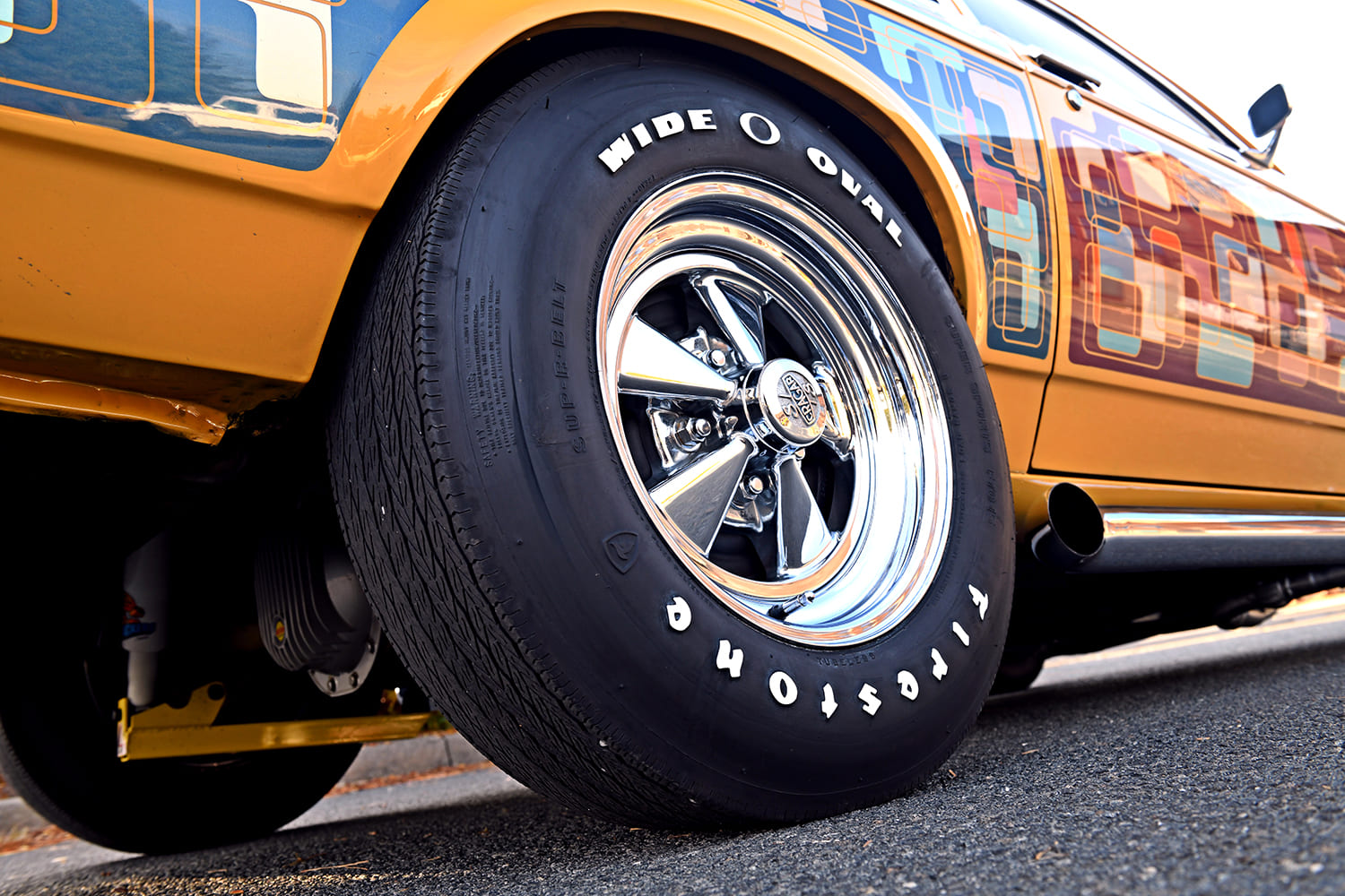 chrome c ragar wheel Firestone wide oval tire close up