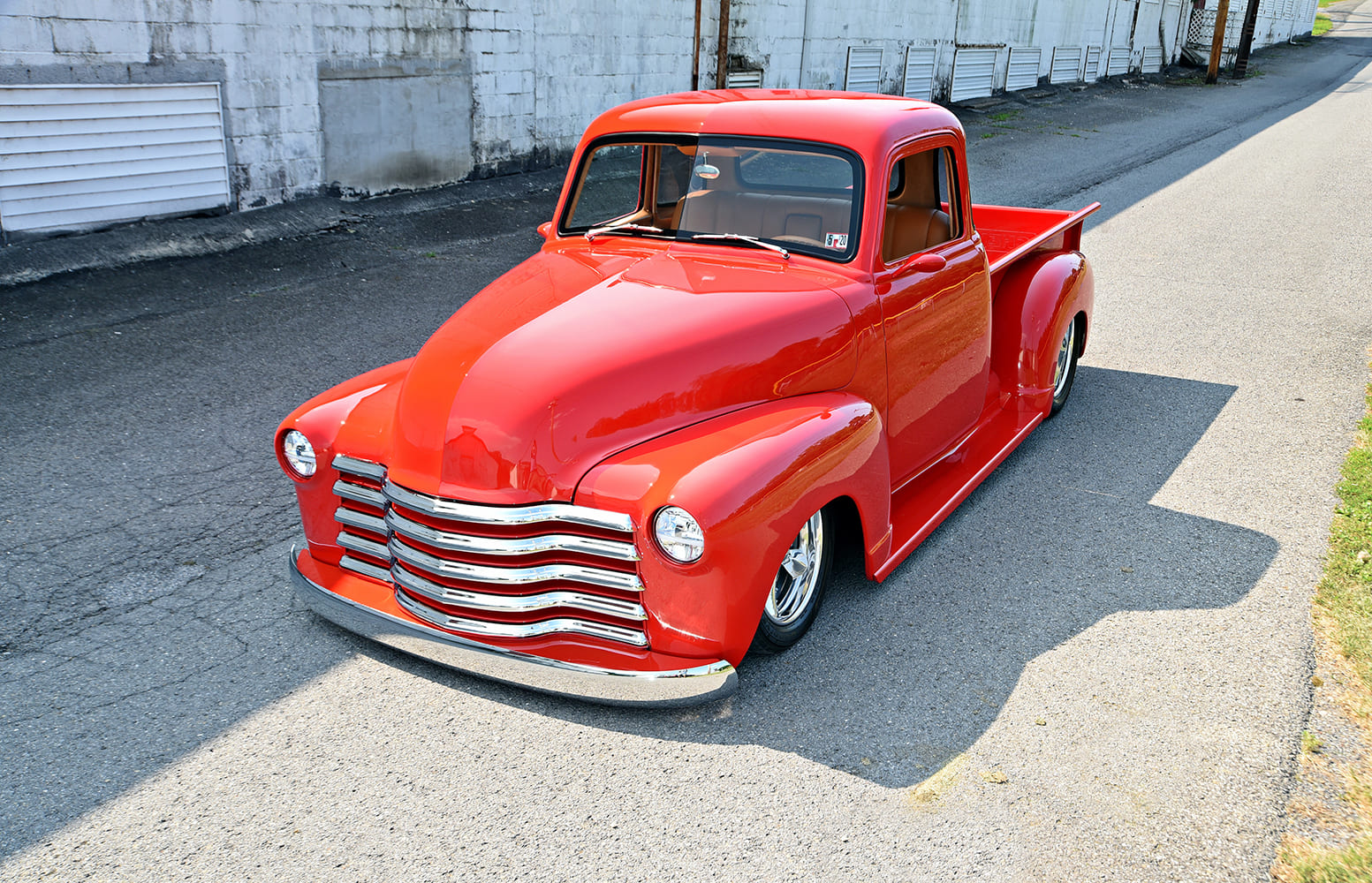 1947 3100 custom red pickup truck angled front view polished wheels classic Chevy hot rod