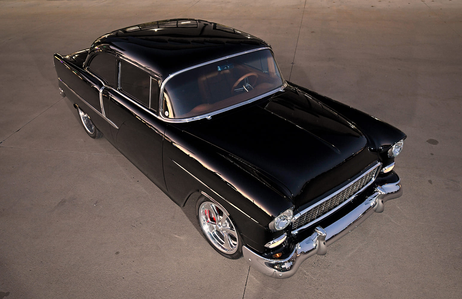 1955 Chevrolet Bel Air black custom coupe high angle front view glossy paint chrome bumper restomod build