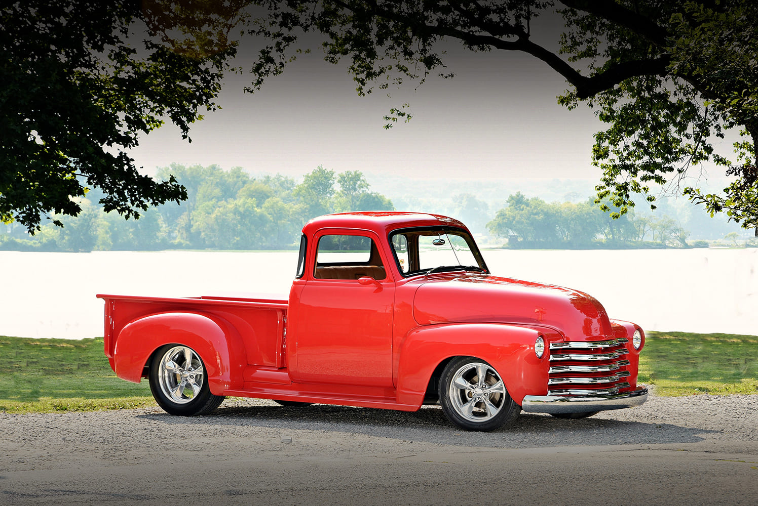 Chevrolet 3100 custom red pickup truck side profile scenic background lowered suspension show truck