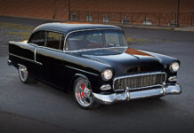 1955 Chevrolet Bel Air black custom restomod front three quarter view lowered stance polished wheels