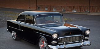 1955 Chevrolet Bel Air black custom restomod front three quarter view lowered stance polished wheels