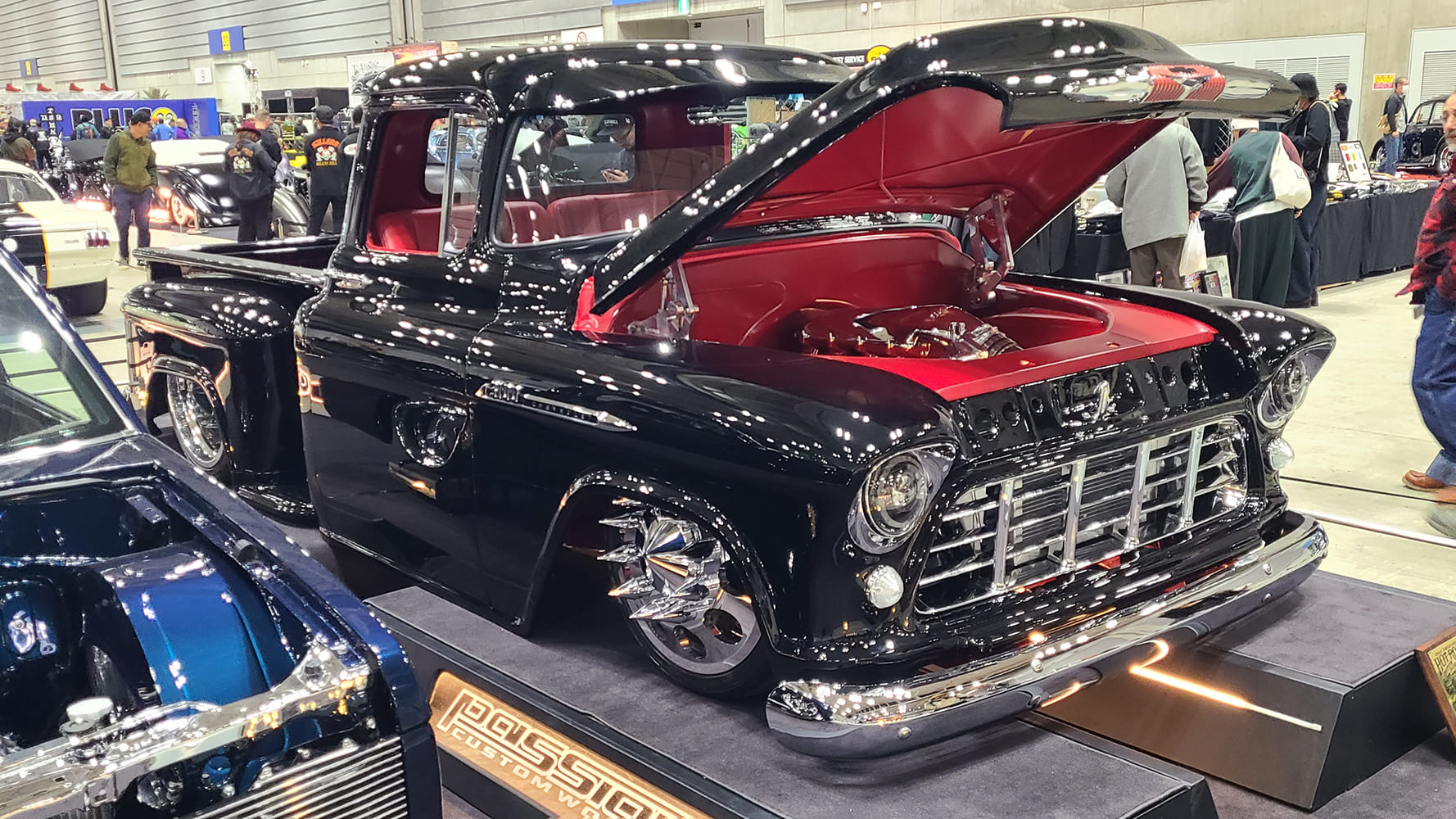 1956 Chevrolet 3100 custom black and red show truck shaved hood open engine bay