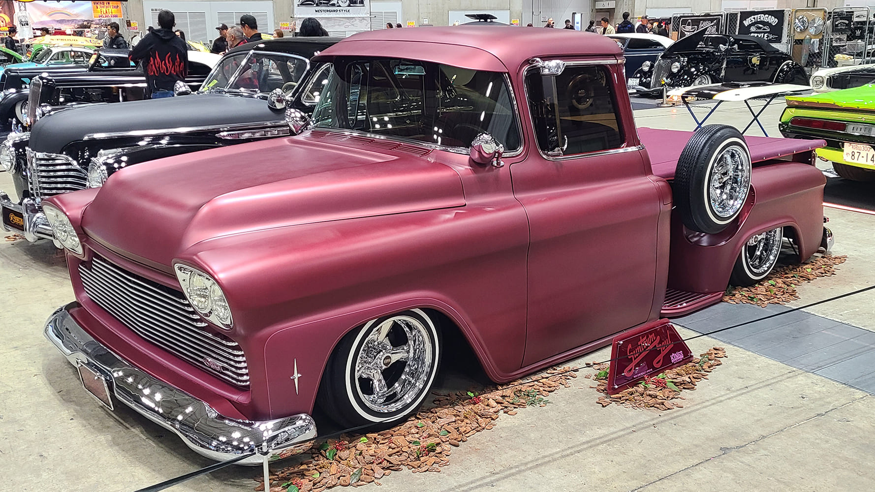 58 Chevrolet Apache custom maroon satin slammed pickup chrome wheels indoor show
