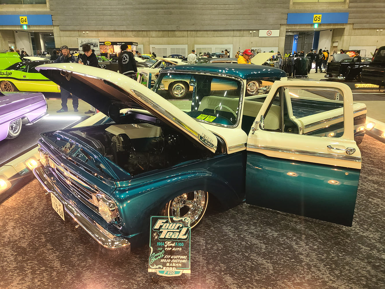 1964 Ford F100 custom teal and white two tone lowered pickup hood open show display