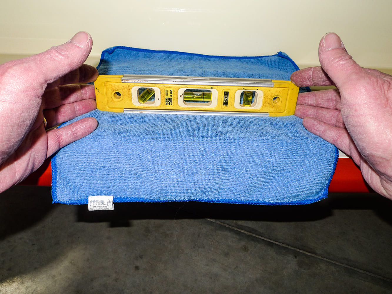 Chevrolet 3100 door alignment check using bubble level during hinge adjustment restoration