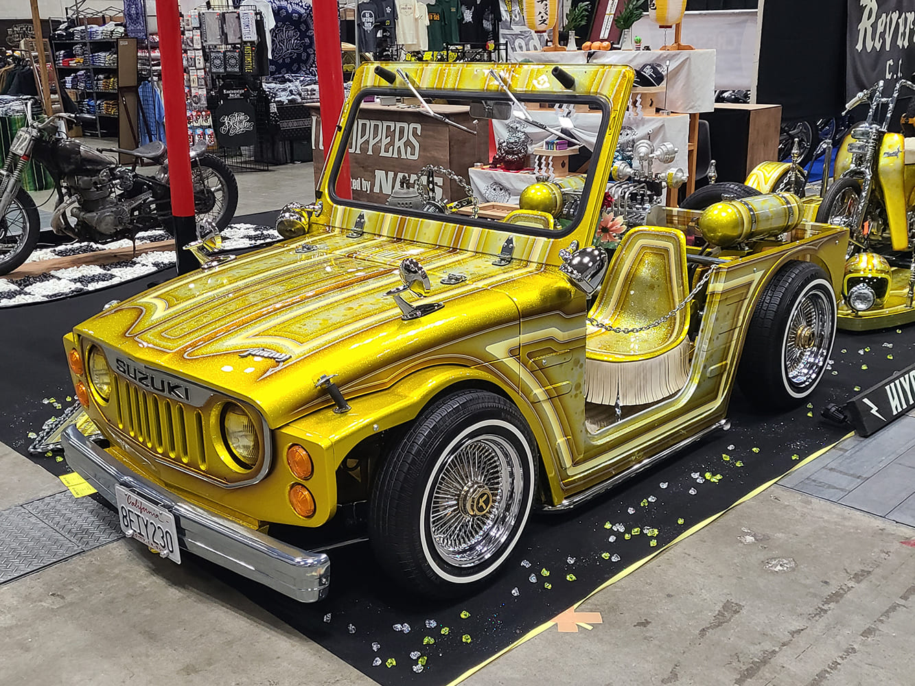 Suzuki LJ10 custom gold metalflake lowrider mini truck indoor car show display wire wheels air tank setup
