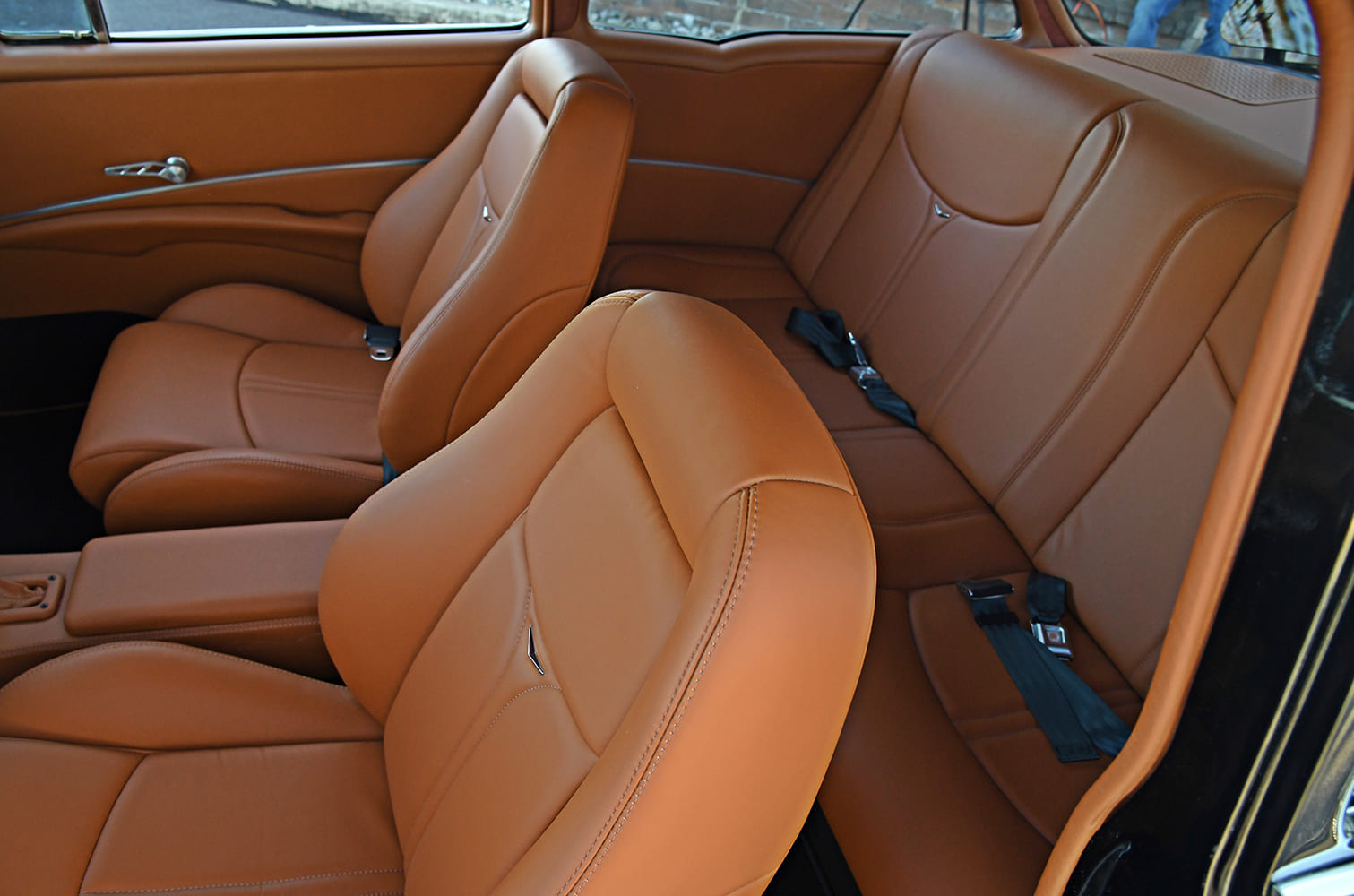 1955 Chevrolet Bel Air custom brown leather interior front bucket seats rear bench restomod cabin