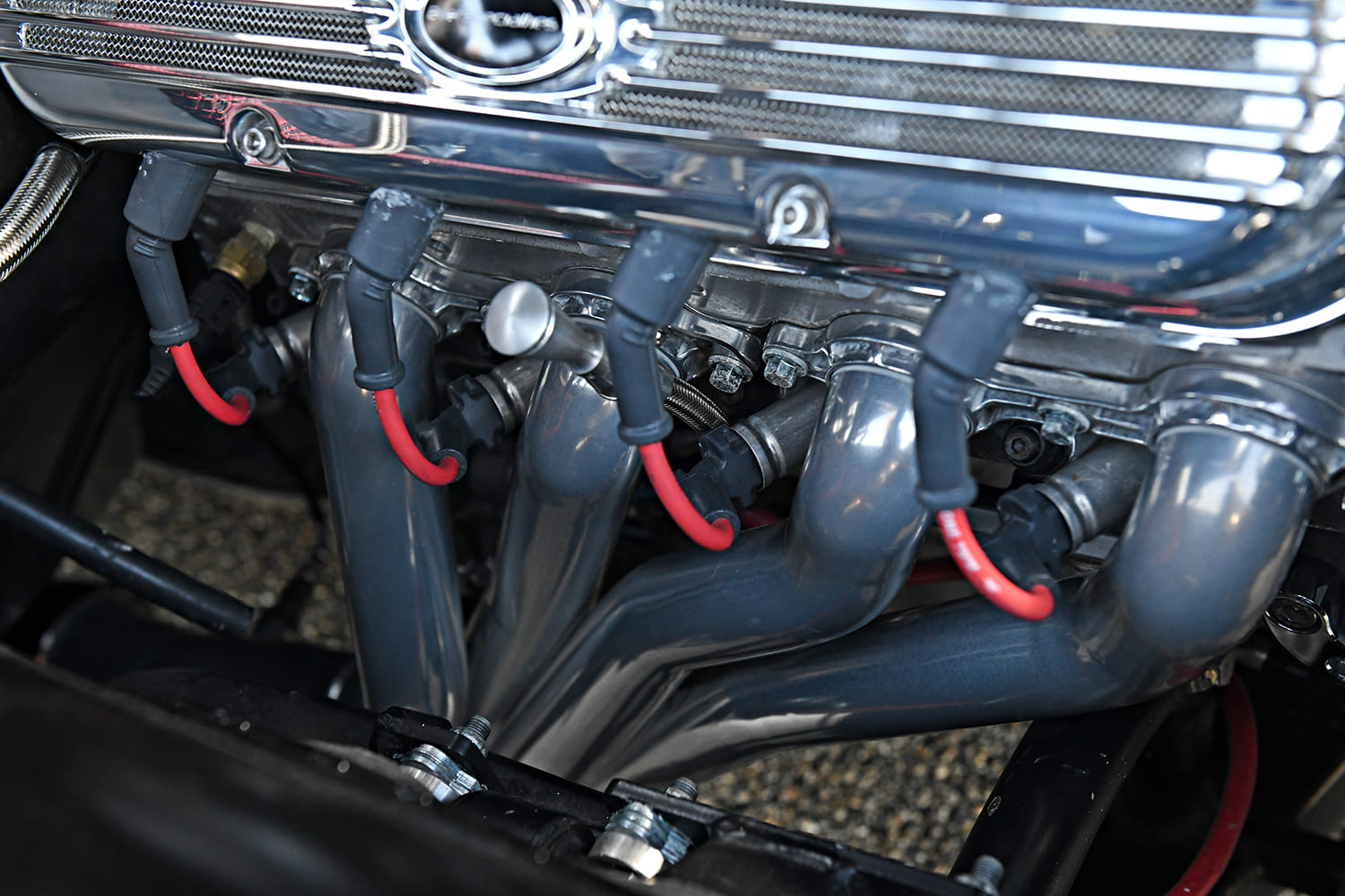 pontiac gto custom performance exhaust headers V8 engine bay detail red spark plug wires