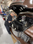 1949 Chevrolet 3100 pickup radiator install custom aluminum radiator mechanic working engine bay
