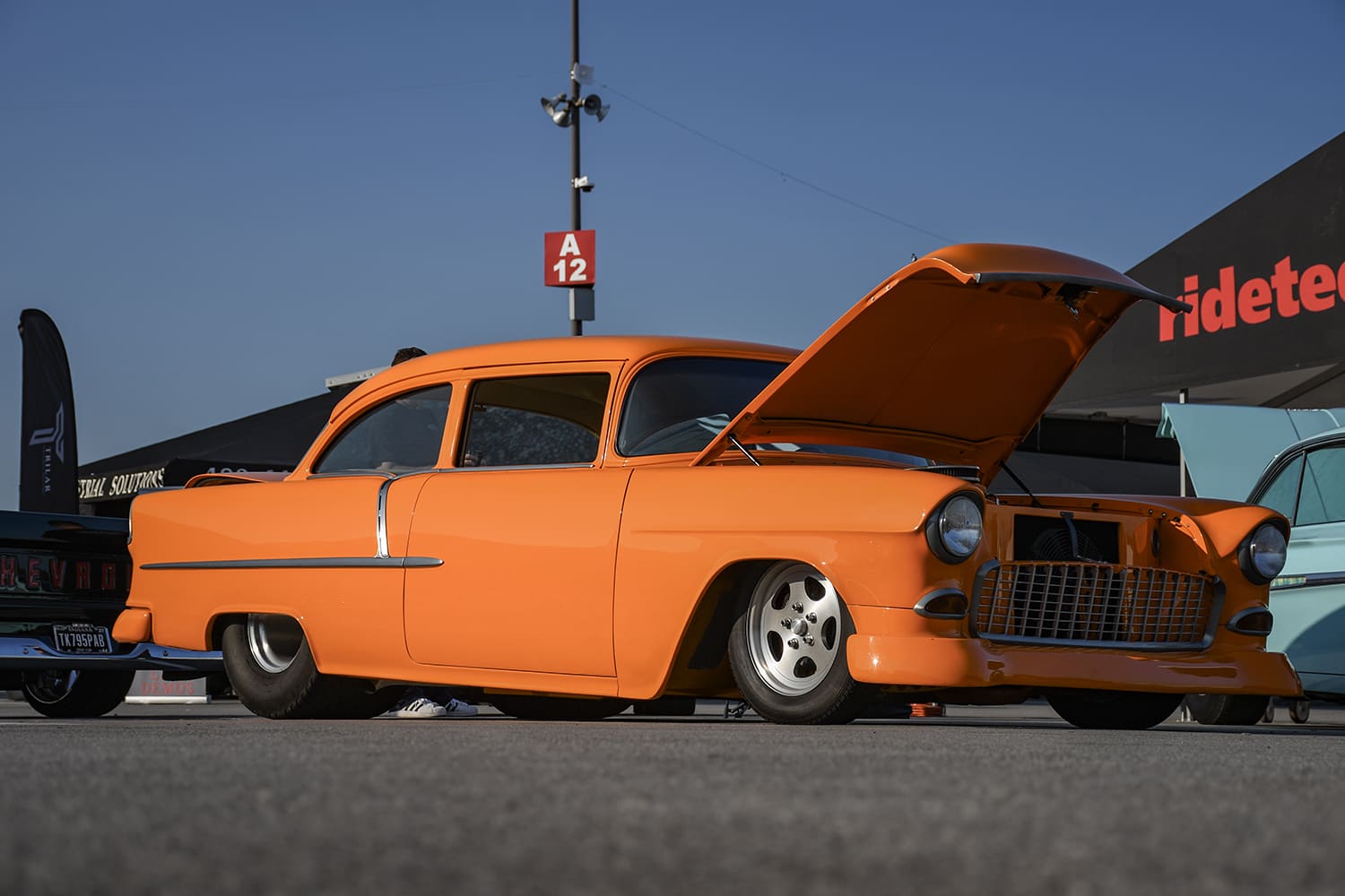 Front quarter shot of a orange 1955 Chevy two-door post pro-street car